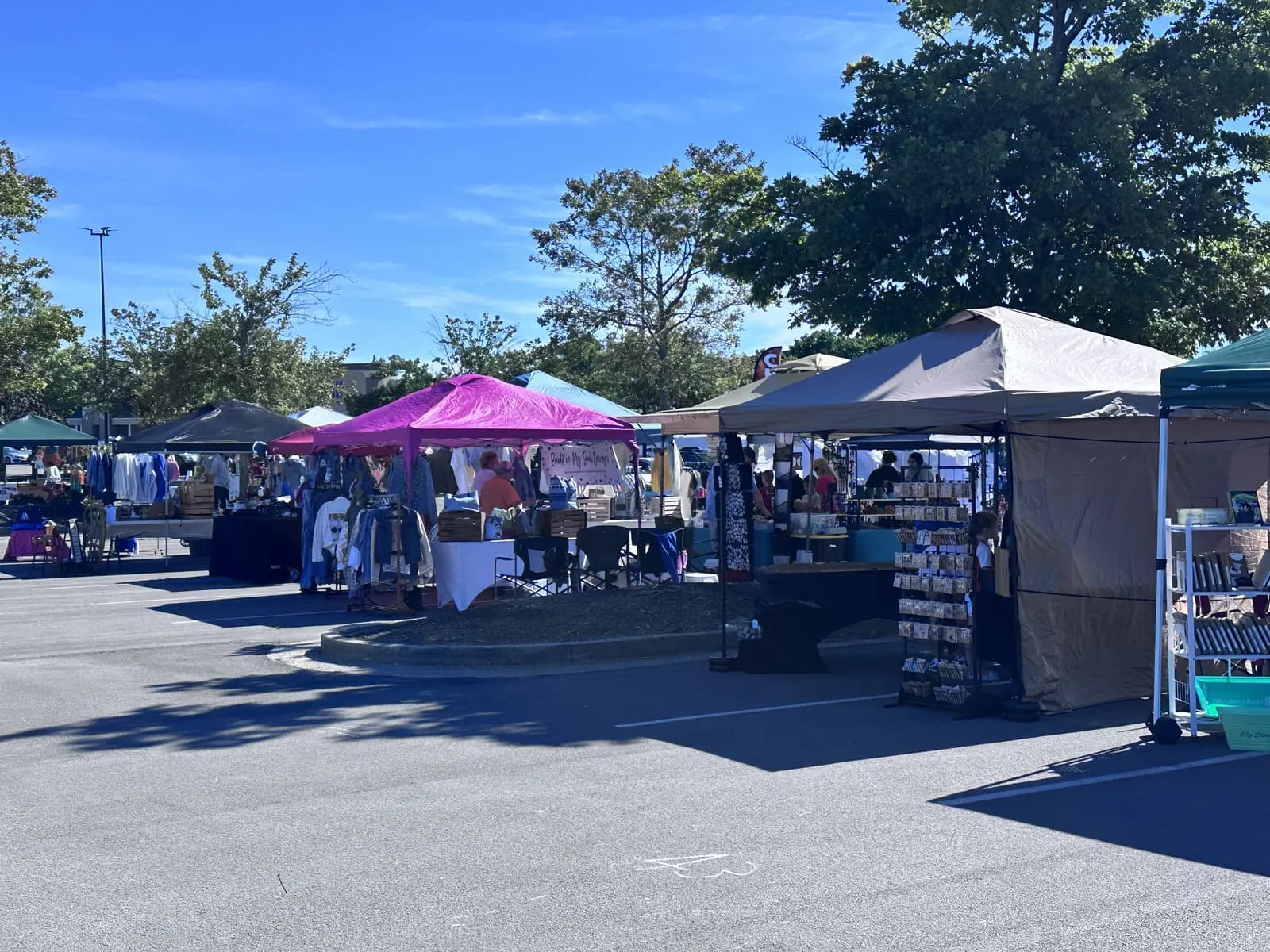 Vendor tents set up in the Hamburg Pavilion parking lot on a sunny fall day